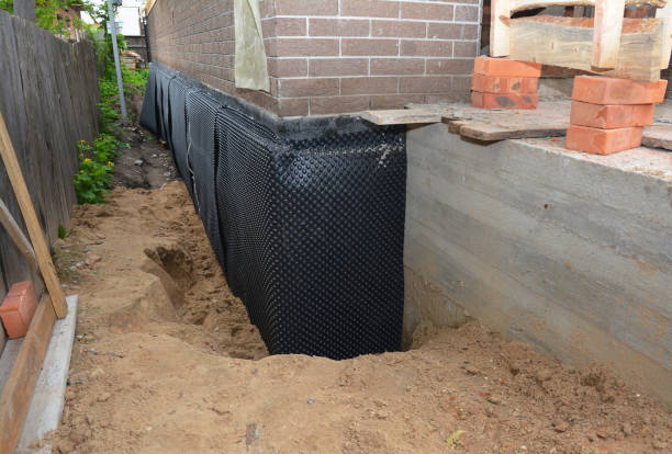Happy homeowners after waterproofing job in Swartz Creek